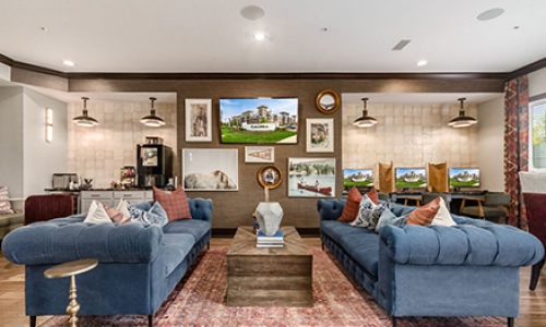 living room with two blue couches