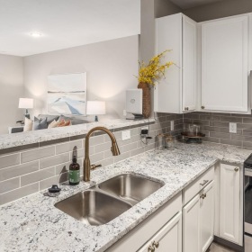 a kitchen with white cabinets