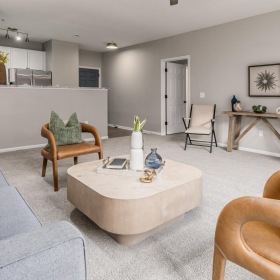 a living room with a table and chairs