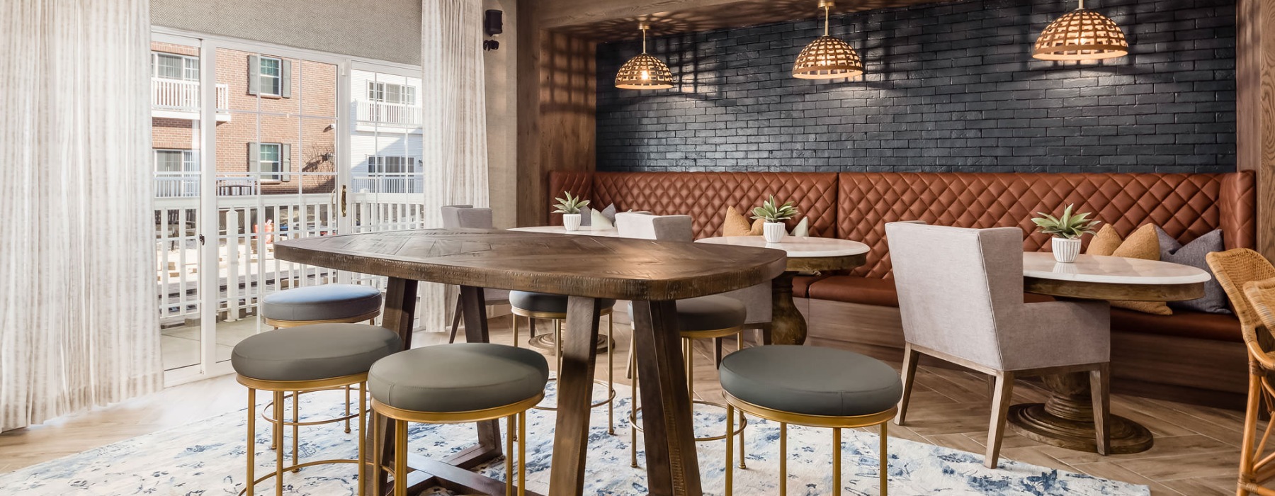 a room with a table chairs and a rug